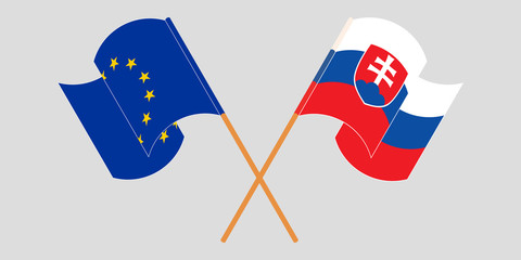 Crossed and waving flags of Slovakia and the EU