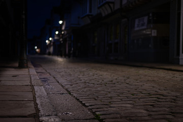 Empty Cobblestone street in Canterbury at night