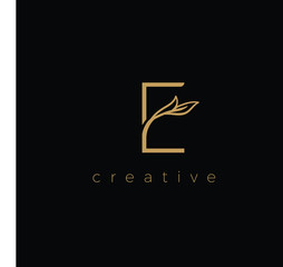 E LETTER LOGO LUXURY WITH DRAWING LEAF