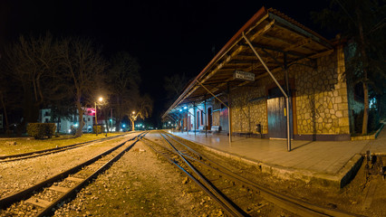 Naklejka na ściany i meble Train station of Kalavrita at night