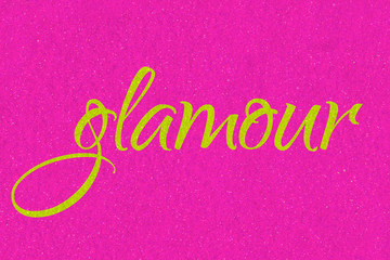 Glamour lettering word golden lime on neon pink glitter texture. Shiny sparkle background