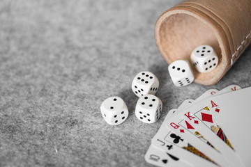 Dices and cards on a table. Usable for home gaming or in a casino