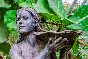 beautiful closeup of the face of a female statue holding a bowl, Garden decorations and architecture