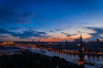 Fototapeta na wymiar Incredible evening panoramic view of the center of Moscow, Moscow river and the monument to Peter the great. Incredible sunset over Moscow.