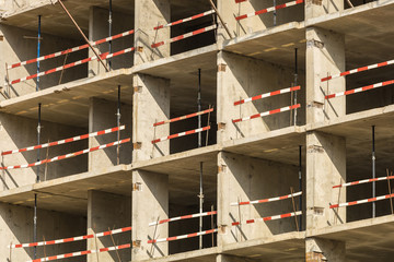 Construction of a new residential complex for young families. Concept urban, business, real estate, mortgage. Sunny clear day.