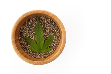 Cannabis seeds and green leave. Vegetarian healthy food. Healthy lifestyle. Flat lay, top view.