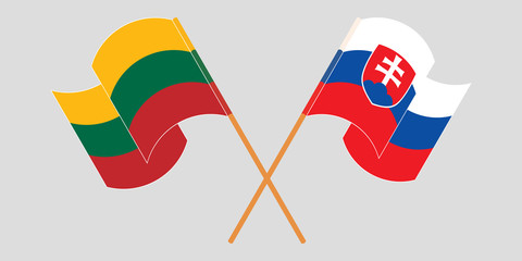 Crossed and waving flags of Slovakia and Lithuania