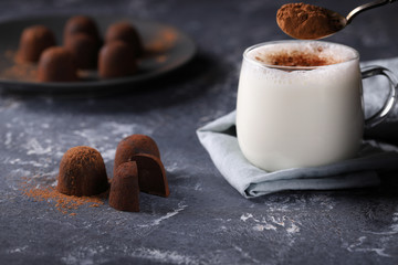 Chocolate truffles, with a mug of hot milk with the addition of a spoonful of cocoa powder. A delicious treat. A wonderful, sweet dessert made from delicate chocolates.