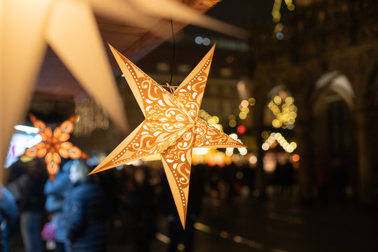 Christmas stars in a sale booth on a historic xmas market in Bremen, Germany with blurry Background and no people