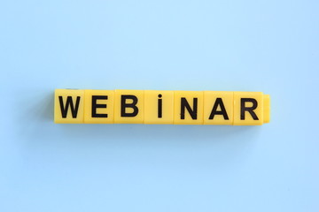 webinar inscription of yellow cubes on a blue background