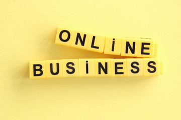 Online business concept. Yellow letters on a yellow background.