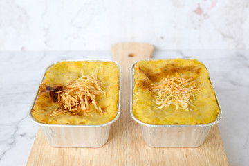 Shepherd's pie baked mashed potato & minced beef with cheese topping. Traditional homemade casserole.