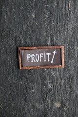 Obraz premium Profit sign on a vintage table.