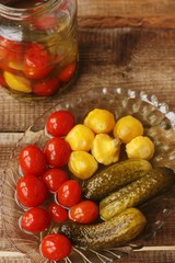 Salted tomatoes cucumbers and squash on the table