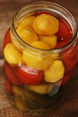 Salted tomatoes cucumbers and squash in a jar 