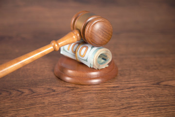 dollar and judge on table