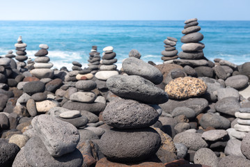 Stone cairns on Puerto de la Cruz coast, Tenerife island, Spain