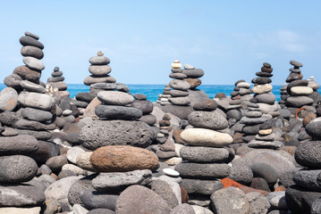 Stone cairns on Puerto de la Cruz coast, Tenerife island, Spain