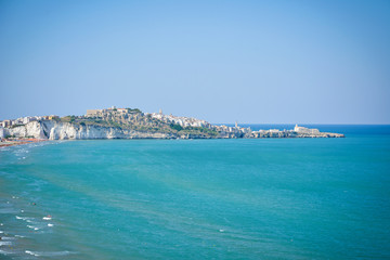 panoramic landscape of the beach and the white cliffs of Vieste, Gargano peninsula, Apulia, Italy