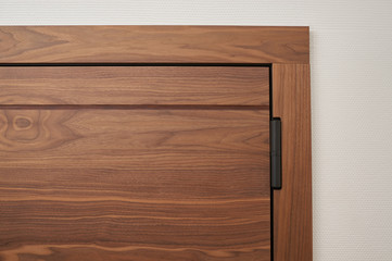 metal door made of natural walnut veneer