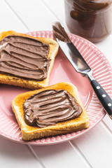 Toast bread with hazelnut spread. Sweet chocolate cream.