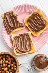 Toast bread with hazelnut spread. Sweet chocolate cream.