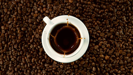 Falling sugar canes into cup of hot coffee