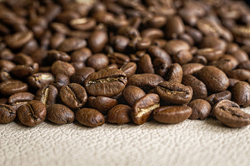 Close up coffee beans on the kitchen table.