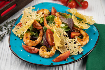 Italian cuisine. Salad with vegetables, sauce and seafood on a white background