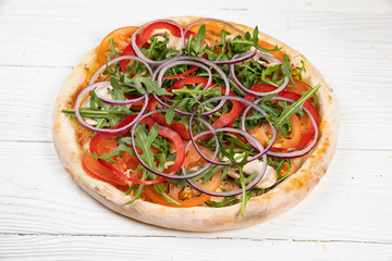 Italian pizza on white wooden background