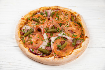 Italian pizza on white wooden background