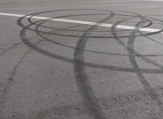 Black trail from rubber tires on the asphalt