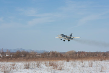 Fototapeta na wymiar Military jet bomber Su-24 Fencer flying