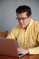 Man glasses home office with laptop