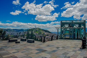 QUITO, ECUADOR, FEBRUARY 02, 2018: Outdoor of Panecillo hill view from yaku water museum of the city of Quito and some buildings