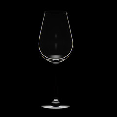 Red wine glass on black background. Silhouette on low key light