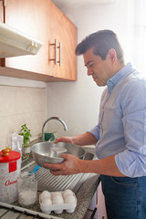 man preparing food in kitchen home indoors