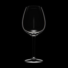 White wine glass on black background. Low key light