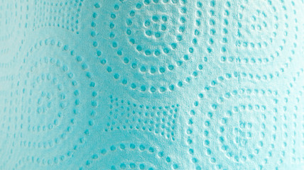 Blue roll of modern toilet paper on a blue background. A paper product on a cardboard sleeve, used for sanitary purposes from cellulose with cutouts for easy tearing. Embossed drawing