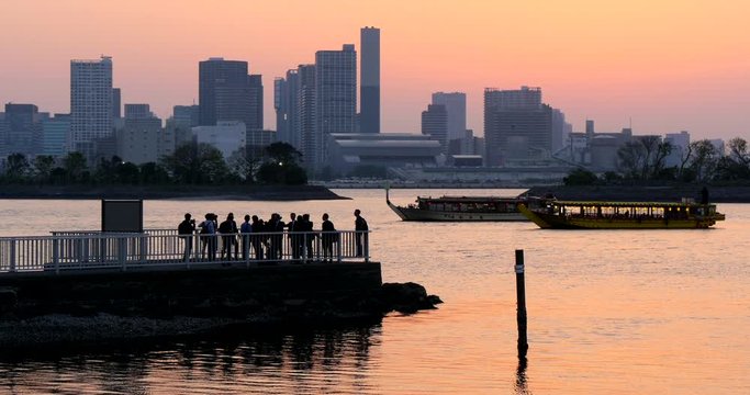 Sunset at Tokyo Bay with Businessman After Work Enjoying at the Harbor 4K