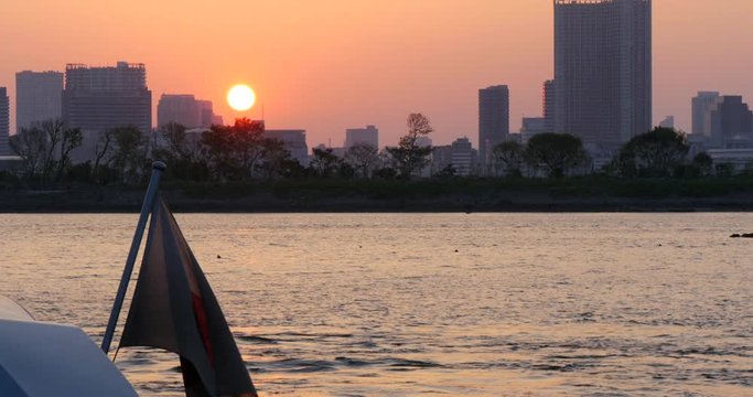 Japanese flag waving in Tokyo's sunset at beach. Sad Flag, Goodbye Japan 4K