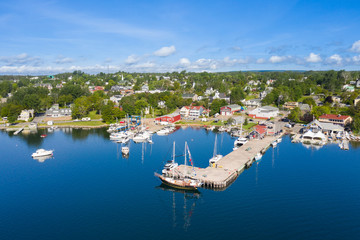 Fototapeta na wymiar Aerial view of the marina in Baddeck, Nova Scotia, Canada. The town pier is visible in foreground.