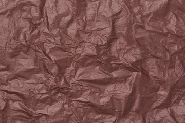 crumpled brown and burgundy craft paper texture, crumpled paper background, chocolate rich color, vintage mood