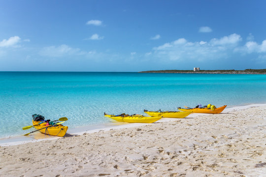 Kayaks by a tropical ocean in the Bahamas