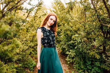 portrait of beautiful young girl in dress in the garden, female portrait outdoors