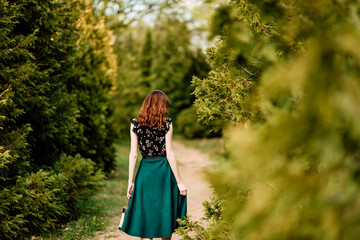 portrait of beautiful young girl in dress in the garden, female portrait outdoors