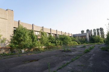 Ruins of abandoned buildings in 1986. Soviet architecture in Chernobyl. Danger of infection of...