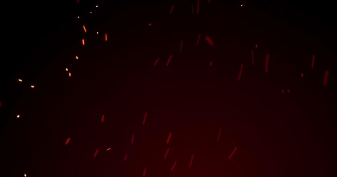 Fire sparks and red flame sparkles, red light glitter, particles on black background. Golden yellow and red glowing fire flame sparks and heat blaze glittery flares shine