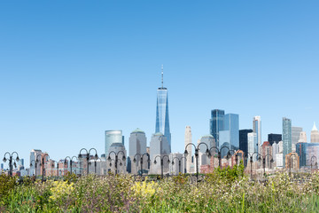 Fototapeta premium New York City Skyline with a unique, colorful flower garden and charming, quaint lighting across the panoramic foreground.