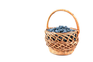 Fototapeta na wymiar blueberry berries in wicker basket isolated on white background